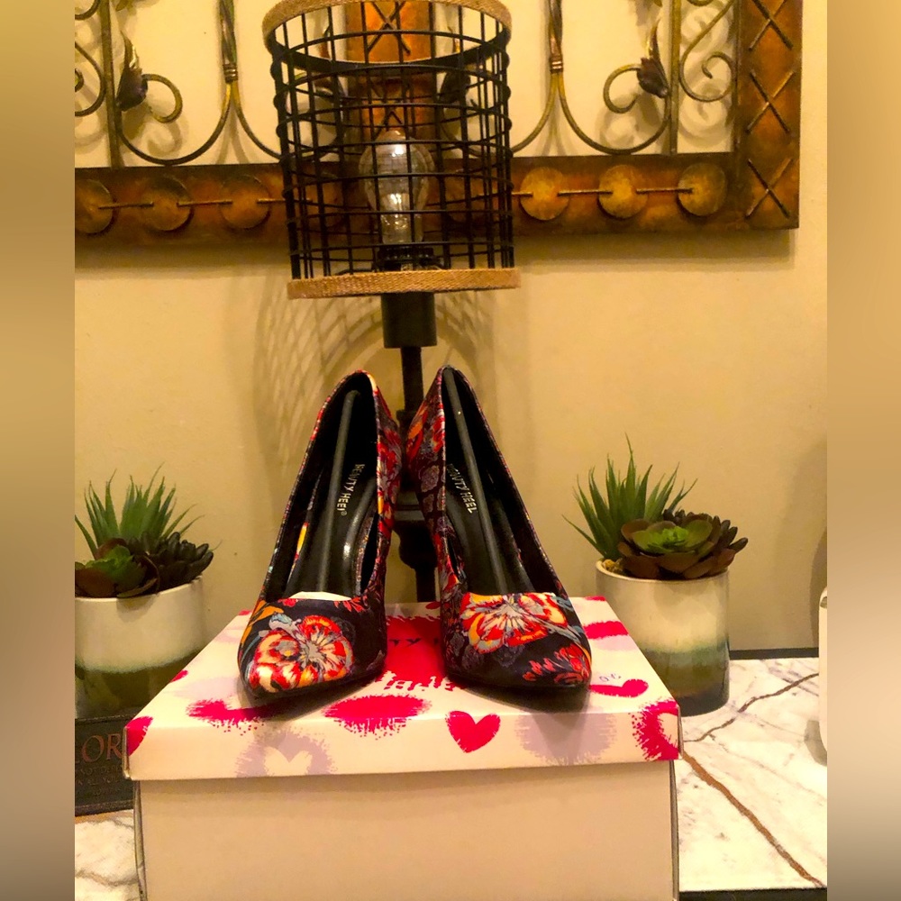Black multi colored pumps; worn twice; perfect condition; very nice
